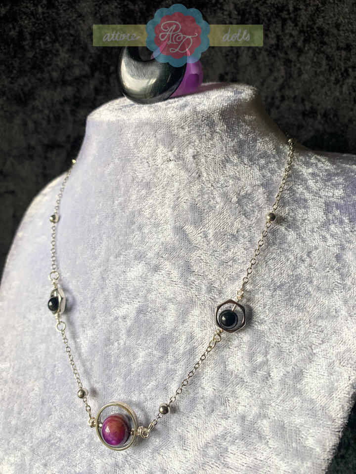 Space inspired fidget necklace with multi coloured tigers eye and rainbow obsidian beads.