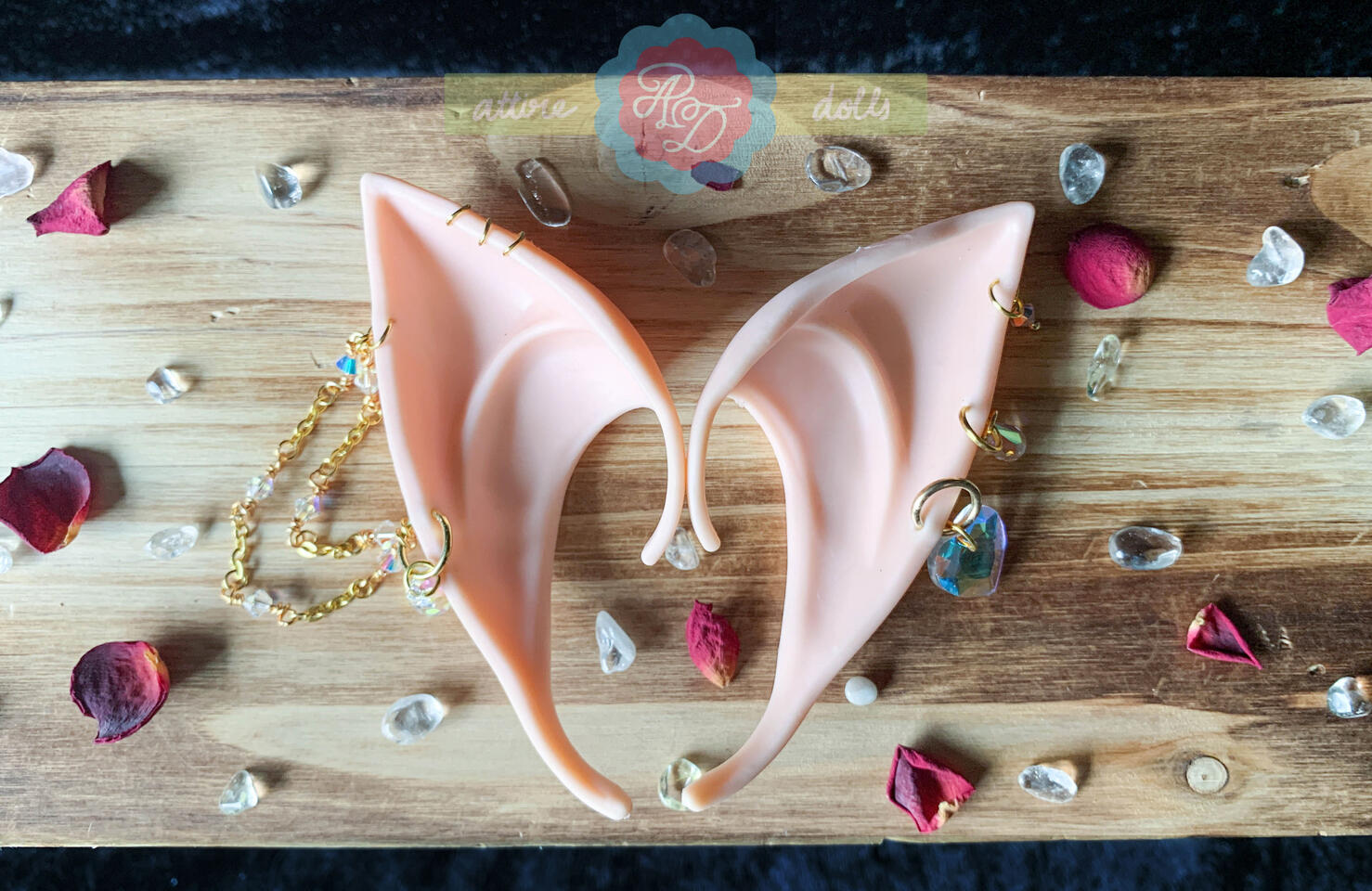 Custom pierced fake elf ears with irridescent beads and charms for a Zelda cosplay.