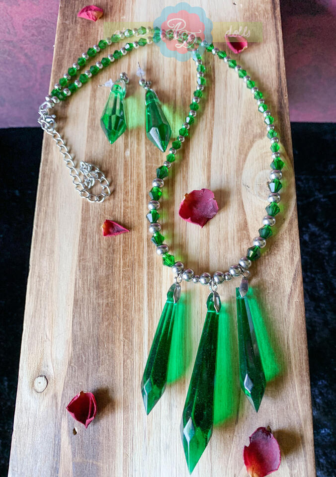 Stainless steel necklace with resin pendants, green bicone beads and matching earrings.